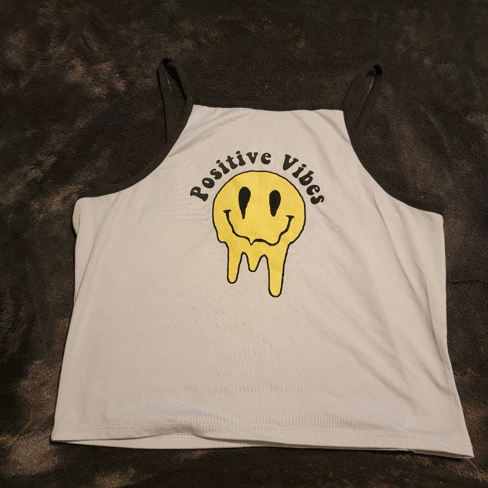 Positive vibes melting smiley crop tank top